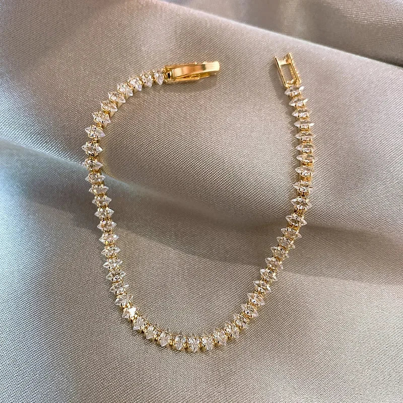 Bracelet Tennis Cristal Doré — Le bijou 5 étoiles qui transforme chaque look